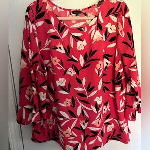 Really pretty red top with lantern sleeves floral accent